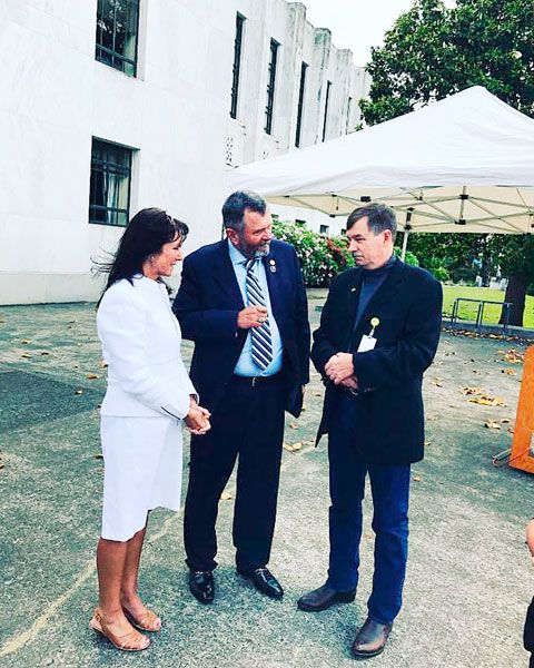 Submitted photo##State Sen. Brian Boquist and his wife Peggy talk to Green Beret veteran Greg Walker during a rally earlier this month to support legislation regarding access to mental health services for veterans.