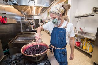 Marcus Larson/News-Register ## Alchemist’s Jam owner Danny Roberts prepares a batch of blueberry jam with lemon zest, slowly bringing the fruit to a boil before pouring it into jars.