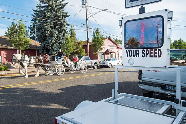 Marcus Larson/News-Register##
Don Price of Gypsy Rose Carriage takes patrons down Ferry Street for a slow relaxing ride during Dayton Friday Nights.