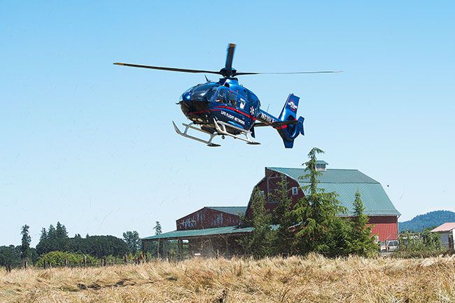Marcus Larson/News-Register##
A Life Flight helicopter lifts off from the scene of a fatal collision on Highway 99W south of McMinnville Monday, July 3. Two helicopters and multiple ground ambulances were required to transport patients from the scene.