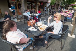 News-Register file photo##During the first summer Dine Out(side) in downtown McMinnville, Sheri Lunsford, left, and Susan MacLean enjoy lunch at McMenamins. About 30 restaurants will set up tables on Third Street this summer during the second round of Dine Out(side). News-Register file photo##During the first summer Dine Out(side) in downtown McMinnville, Sheri Lunsford, left, and Susan MacLean enjoy lunch at McMenamins. About 30 restaurants will set up tables on Third Street this summer during the second round of Dine Out(side).