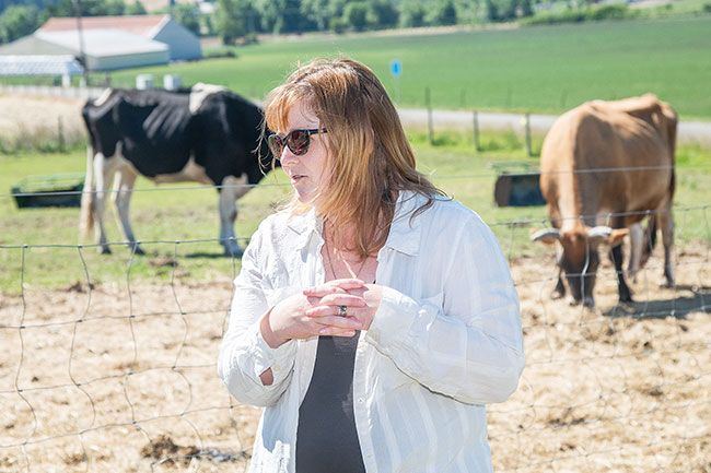 Rusty Rae/News-Register ## Michelle Blake, a Dayton native, volunteers as vice president and, often, fence builder at Wildwood. The farm animal sanctuary on North Valley Road attracts many volunteers, including people from Portland.