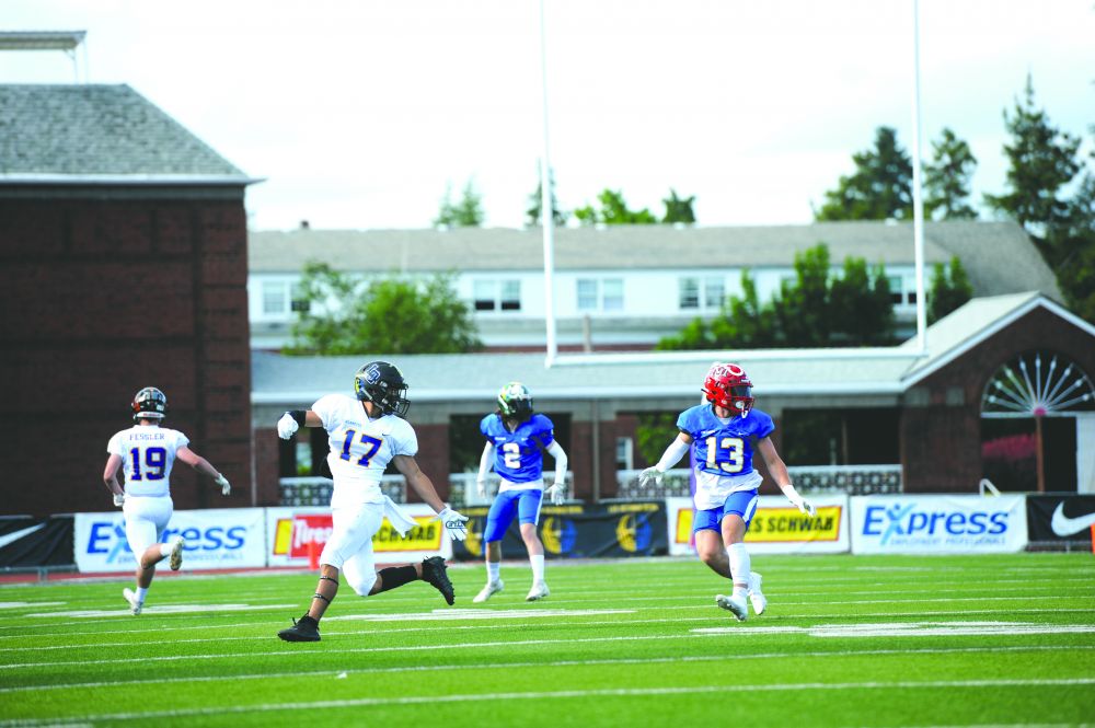 Logan Brandon/News-Register##
Team Columbia defensive back Austin Rapp (13) looks for the ball as he defends Team Willamette’s Cody Hall (17) during Saturday’s Les Schwab Bowl.