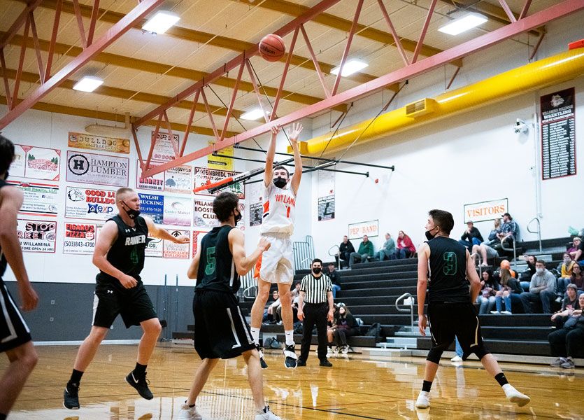 Rusty Rae/News-Register file photo##
Willamina forward
Kaleb Floyd launches a
jumper during a league game
against Rainier. Floyd was
recently named the Coastal
Range League Player of the
Year for leading the Bulldogs
to the 2021 league title. He
paced the team in scoring
and rebounding for the
second straight season.