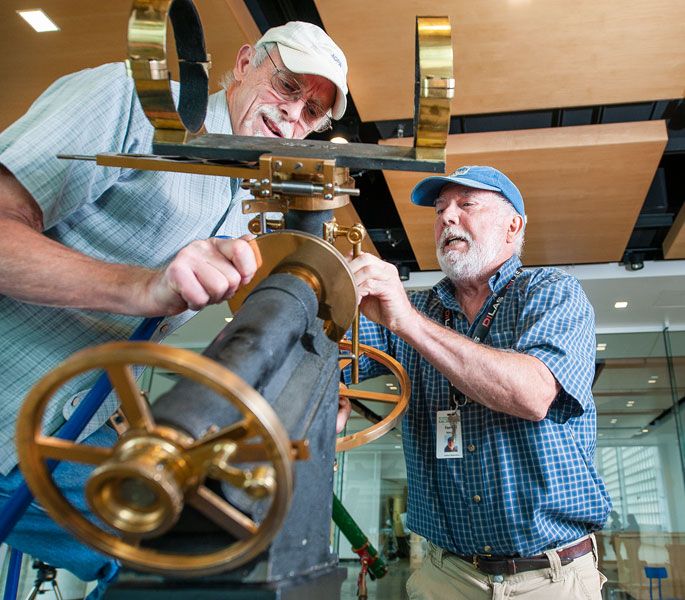 Rusty Rae/News-Register ## Retired Linfield professor Bill Mackie (left) and Carlton Observatory at Evergreen co-founder Forrest Babcock wrestle with adjustments to a 19th century telescope in preparation for situating the six-inch barrel of the mechanism on its base.