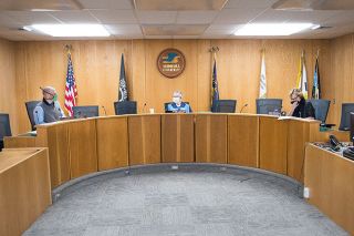 Marcus Larson/News-Register##Yamhill County Commissioners use masks during Thursday s hearing.