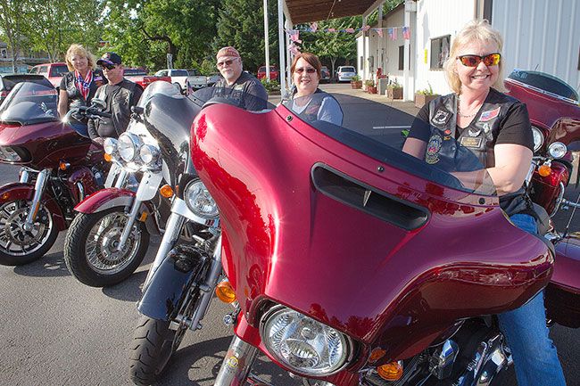 Rockne Roll/News-Register##From right, American Legion Riders members Jeri Paull, Debra Jushae-Fieber, Chris Sieber, Bob Hyde and Wendy Hyde show off their bikes as they prepare for a ride.