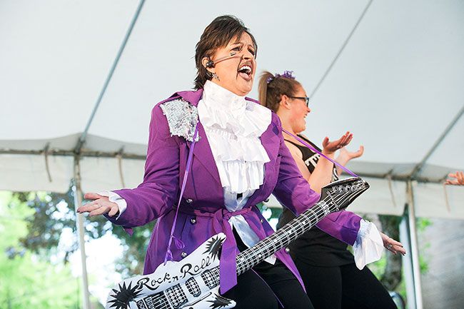 Marcus Larson / News-Register##Dressed as Prince, Carrie Schadewitz of Willamette Valley Cancer Foundation performs in the lip sync contest, placing second for her routine.
