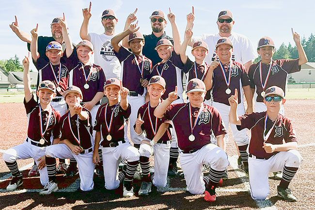 Photo courtesy Lauri Douthit##
Junior National Team Coleman
raises their fingers in the air in celebration following their district title.