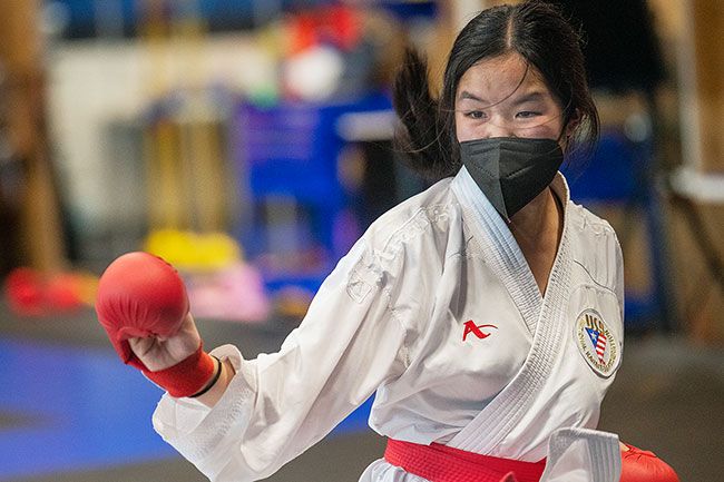 Rusty Rae/News-Register##
Mendonca Academy’s Natalie Lai shows her ferocity during a sparring match
Wednesday in McMinnville. Lai recently took third place in the 12-13 year-old elite kumite
National Championships in Spokane.