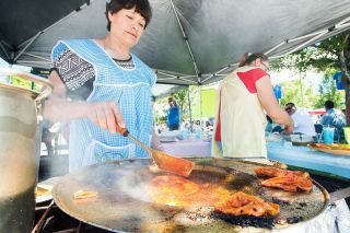 Marcus Larson/News-Register##
Victoria Flores cooks authentic enchiladas dipped in chile sauce at Festival Cadena de Vida. Marcus Larson/News-Register##
Victoria Flores cooks authentic enchiladas dipped in chile sauce at Festival Cadena de Vida.