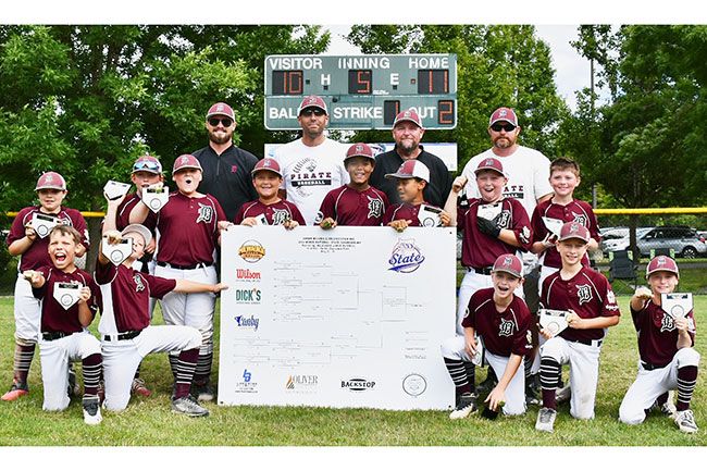 Photo courtesy Lauri Douthit##
Dayton’s Minor National JBO team poses with their state championship bracket after defeating McMinnville 11-10 Sunday at North Clackamas Park.