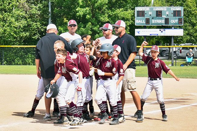 Photo courtesy Lauri Douthit##
Members of the Dayton Minor National baseball team react to winning their second straight state championship Sunday in Milwaukie. The Pirates earned an 11-10 comeback over McMinnville.