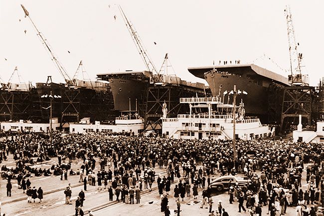 Image: James Russell/Naval History & Heritage Command##USS Alazon Bay, renamed Casablanca just two days prior to launching, at right, about to be launched at Henry J. Kaiser’s shipyard, Vancouver, Washington, on April 5, 1943. Two other escort carriers — probably the Luscome Bay and the Anzio, or possibly the Corregidor — are still under construction at left.