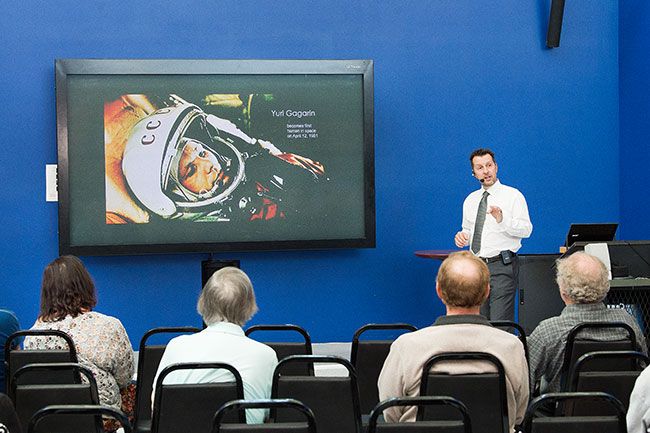 Marcus Larson/News-Register##
OSU history professor Robert Peckyno tells an audience about the
complete history of humans in space. He was one of several speakers at
Saturday s Apollo 11 celebration at the Evergreen museums.