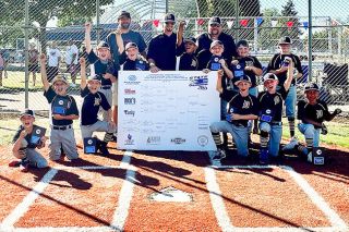 Photo courtesy Lauri Douthit##
The Dayton Minor National JBO team poses victorious with their state tournament bracket after winning the Oregon championship. Photo courtesy Lauri Douthit##
The Dayton Minor National JBO team poses victorious with their state tournament bracket after winning the Oregon championship.