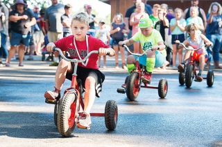Marcus Larson/News-Register##
Gabriel Pond leads his group, taking first place in the Yamhill Derby Days trike races.