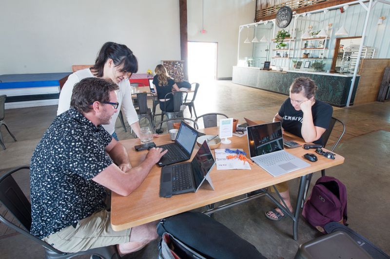 Rusty Rae/News-Register ## Mac Market owners Diana Riggs and Todd Severson review company data online. Along with general manager Britt Kemper, right, they’ve been working to adapt to the pandemic, seeing it as a “creative problem-solving challenge.”