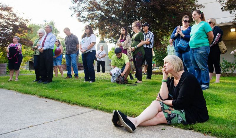 Rockne Roll/News-Register
Melissa Gates, bottom right, and others listen to remarks at a gathering Thursday, July 20, at the Yamhill County Courthouse in McMinnville to honor the victims of the May 2016 racing crash on Highway 99W north of McMinnville