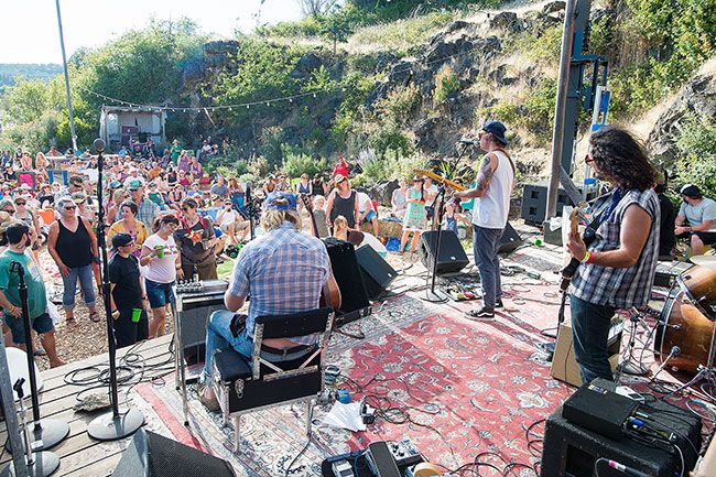 Marcus Larson/News-Register##The Harmed Brothers play to the crowd on the stage that’s surrounded by a rock quarry. Around 1,000 attendees were reported at the roots rock festival that hosts talent from around the United States.