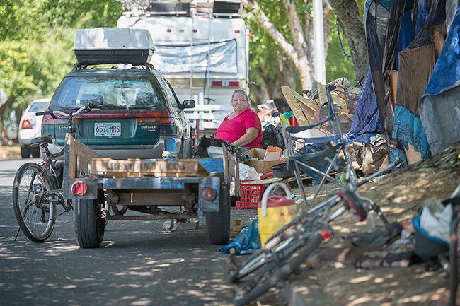News-Register file photo##Donna Campbell pictured in July while living with her husband, Charles, in a tent on the south end of Northeast Marsh Lane in McMinnville. The couple had occupied the same spot for several years before being forced to move by city police.
