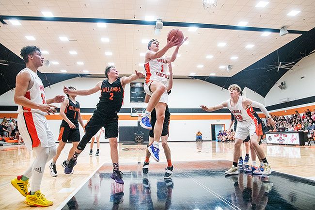 Rusty Rae/News-Register file photo##
Yamhill-Carlton sophomore forward Moroni Seely-Roberts was recently named the 3A State Player of the Year for leading the Tigers to the Oregon championship.