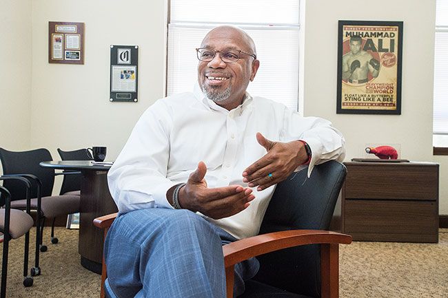 Marcus Larson/News-Register
New Linfield College President Miles Davis talks about his plans to further the school s reputation of excellence and student achievement. In the background is his poster of Muhammad Ali.