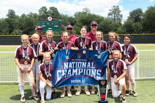 Submitted photo##The Corvallis Lady Knights celebrate their championship in Arizona two weeks ago. Local members of the team in the top row are Charlotte Terry (second from left), Maddix Bowdle (fourth from left) and Mackenzie Bekofsky (fifth from left). Submitted photo##The Corvallis Lady Knights celebrate their championship in Arizona two weeks ago. Local members of the team in the top row are Charlotte Terry (second from left), Maddix Bowdle (fourth from left) and Mackenzie Bekofsky (fifth from left).