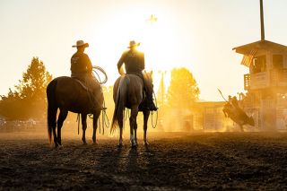 Marcus Larson/News-Register##
Pickup men John Jardine and Casey Hale with Howell Rodeo Company sit and wait patiently for a bull riding run to conclude late into the afternoon at the Yamhill County Fair’s Bullmania event. Marcus Larson/News-Register##
Pickup men John Jardine and Casey Hale with Howell Rodeo Company sit and wait patiently for a bull riding run to conclude late into the afternoon at the Yamhill County Fair’s Bullmania event.