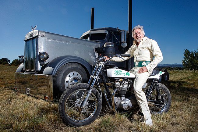 Rockne Roll/News-Register##Everything about Denny Edwards’ Aug. 12 motorcycle jump will be vintage — his 1966 Triumph bike, which he used for jumps in the 1970s and ’80s; his protective leather suit, which features the Flying Irishman logo and shamrocks he rocked back in the day; the Peterbilt trucks he’ll sail over; and Edwards himself, who’s 72, the oldest man to attempt such a feat.