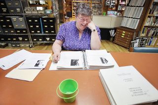 Rockne Roll/News-Register##Susan Read discovers fascinating details as she pores over historical records at the Yamhill County Historical Society museum.