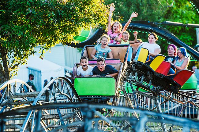 Rusty Rae/News-Register##
William and Walker Whitney and other get a thrill ride on the roller coaster at the Yamhill County Fair. The carnival drew a crowd, Fair Manager Gary Wertz said, in part because it was the only carnival in the county this year.