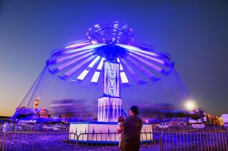 Rusty Rae/News-Register##
Riders spin on the Yo-Yo, one of many rides offered at this year’s Yamhill County Fair & Rodeo. The rides lighted up the evenings, which also featured rodeo shows, a demolition derby and big-name concerts.