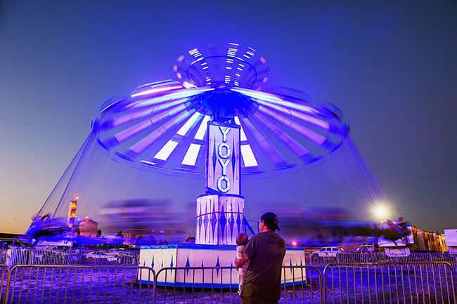 Rusty Rae/News-Register##
Riders spin on the Yo-Yo, one of many rides offered at this year’s Yamhill County Fair & Rodeo. The rides lighted up the evenings, which also featured rodeo shows, a demolition derby and big-name concerts.