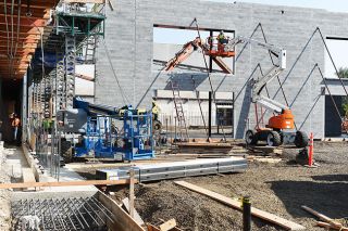 Rusty Rae/News-Register##Workers continue construction on additions to McMinnville High School Tuesday. The crews are making the final effect to have most of the building’s new features available for the first day of school; however, construction will continue throughout the school year.
