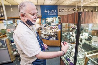 Marcus Larson/News-Register ## David Spalding examines a rare pink diamond for sale in his store, Timmreck & McNicol Jewelers in McMinnville. He finds unusual and beautiful stones on his semi-annual buying trips to world diamond markets. Marcus Larson/News-Register ## David Spalding examines a rare pink diamond for sale in his store, Timmreck & McNicol Jewelers in McMinnville. He finds unusual and beautiful stones on his semi-annual buying trips to world diamond markets.
