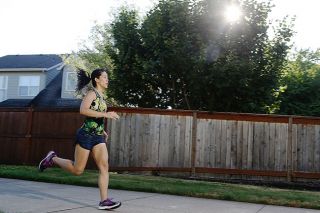 Rockne Roll/News-Register##Tiffany Henness takes her morning run on the linear trail in her West McMinnville neighborhood. She used to run in the evenings, she said, but morning workouts fit better with her busy lifestyle.