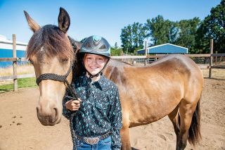 Rusty Rae/News-Register##Lindy, a yearling Mustang, and Lexi Merkel, 11, are best friends now, although they ve known each other only since May though the Teens and Oregon Mustangs program.