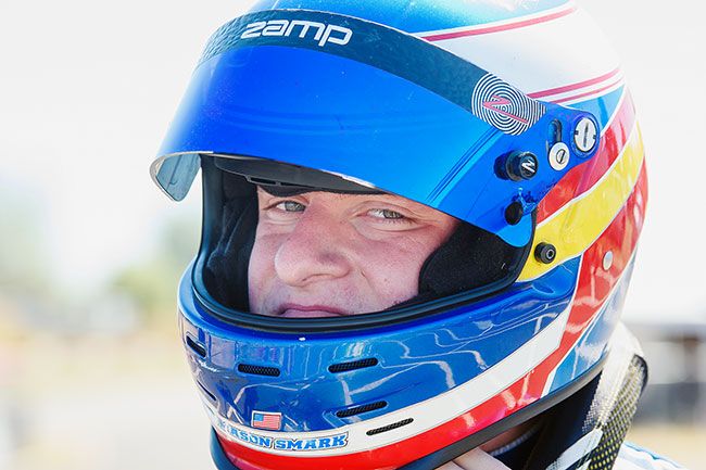 Rusty Rae/News-Register##
Mason Smark is all business once the helmet goes on as he readies for a heat of racing Sunday at the Mac Track.