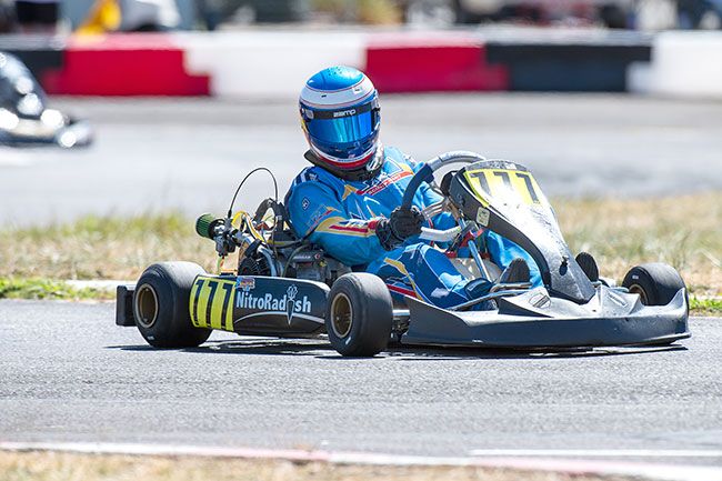 Rusty Rae/News-Register##
Mason Smark, a junior-to-be at McMinnville High School, sets up his World Formula kart for a turn during competition Sunday at the Mac Track, located at the Yamhill County Fairgrounds.