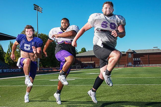 Rusty Rae/The News-Register##
The Wildcats veteran team will be lead by three preseason All-Americans: (from left) defensive end Travis Swanson, center Matt Metcalf and offensive guard Julien Sears.