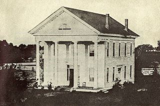 Image: Polk County Historical Society##The Polk County Courthouse as it appeared in 1859. It was one of the second-story windows on this building that Enoch Smith leaped out of in a desperate attempt to escape from custody and avoid a death sentence.