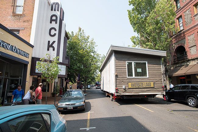 Marcus Larson/News-Register##
A manufactured home stops right next to the Mack Theater just a few feet before hitting telephone and fiber lines on Evans and Third St.