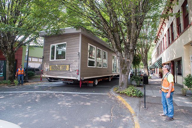 Marcus Larson/News-Register##
The manufactured home was backed up five blocks down third street all the way to Lafayette Ave, snapping several branches along the way.