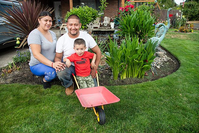 Rusty Rae/News-Register ## Julian, 3, helps his parents, Jonathan and Melissa Martinez, with their flowers and other plants. Their yard, which features a pond and waterfall, was honored by the McMinnville Garden Club this month.