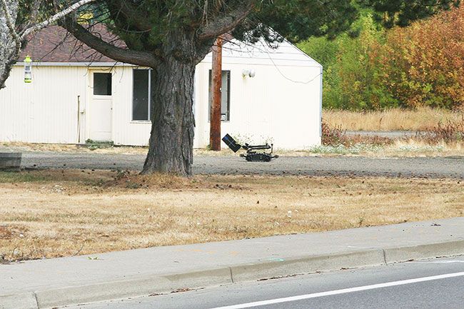Brent Merrill / Smoke Signals##A bomb squad robot
investigates a suspicious package left in front of the
Grand Ronde mailroom on
Friday. The item turned out
to be a hobo meter.