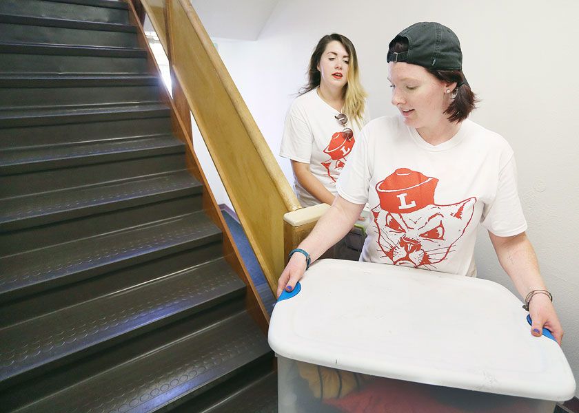 Rockne Roll/News-Register
Linfield students Maren Geesey, front, and Brittany Seyl help freshman move into Miller Hall. Classes will start Monday.
