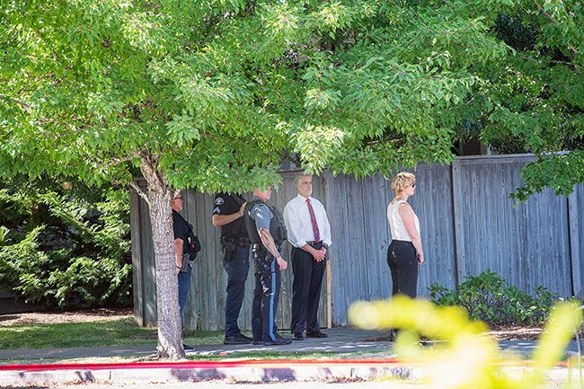 Rusty Rae/News-Register##Yamhill County District Attorney Brad Berry (in white shirt) responded to the site of the shooting.