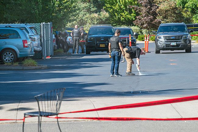 Rusty Rae/News-Register##The investigation included marking a specific area in the parking lot where the officer-involved shooting took place and the sharing of information among law enforcement personnel. The Oregon State Police are now leading the investigation.