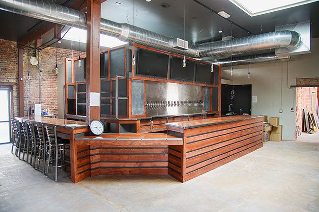 Rusty Rae/News-Register##

The Queeners did much of the remodeling of their new space themselves, including building a new bar and kitchen area. The bar top features an undulating river of pennies, a reminder of the one in Two Dogs Taphouse s location.